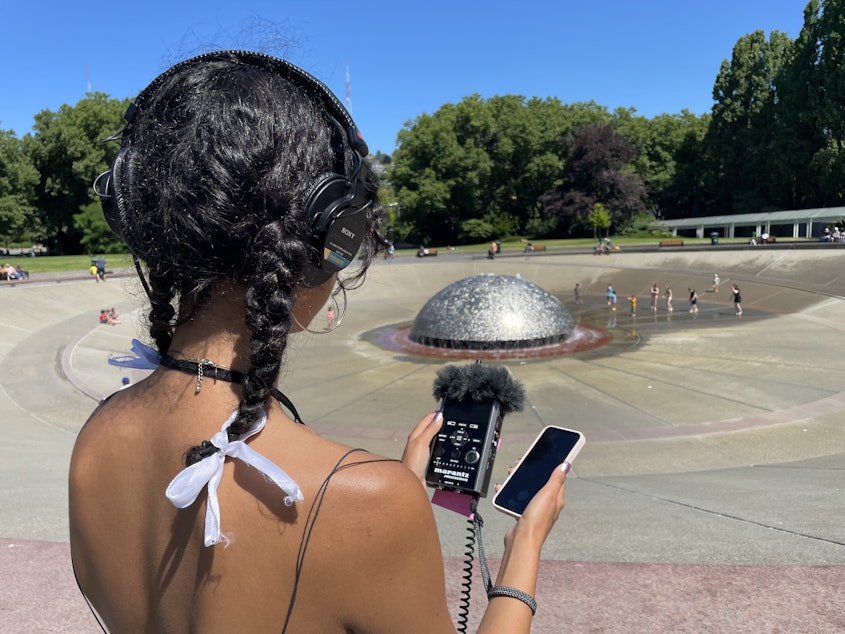 caption: Nyla Moxley records audio at Seattle Center on July 14, 2023.