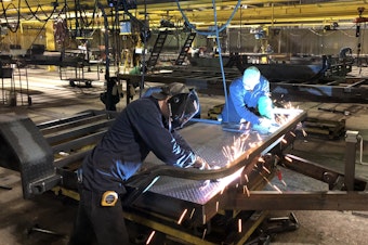 caption: Load Trail has had a hard time hiring welders to fabricate its trailers since Immigration and Customs Enforcement agents arrested about a quarter of its workforce in August.