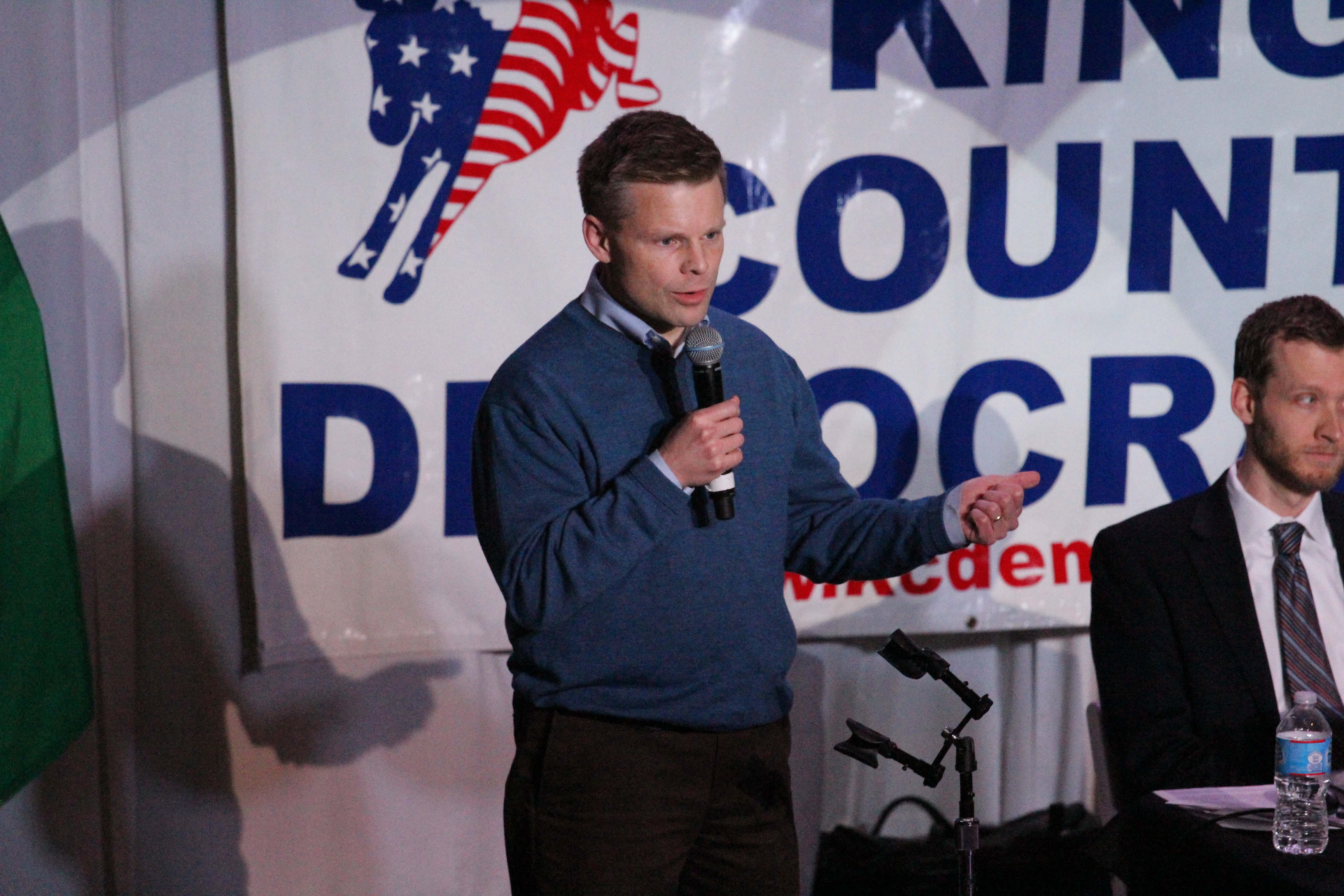 caption: Rep. Jamie Pedersen speaks before party activists in the 43rd District.