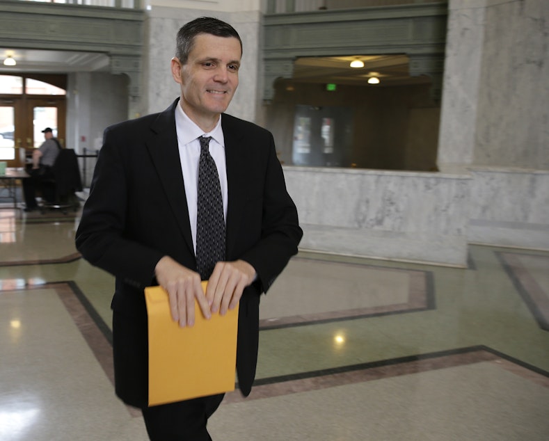 caption: Washington state auditor Troy Kelley arrives at the federal courthouse in Tacoma, Wash., for a hearing Monday, May 11, 2015. 
