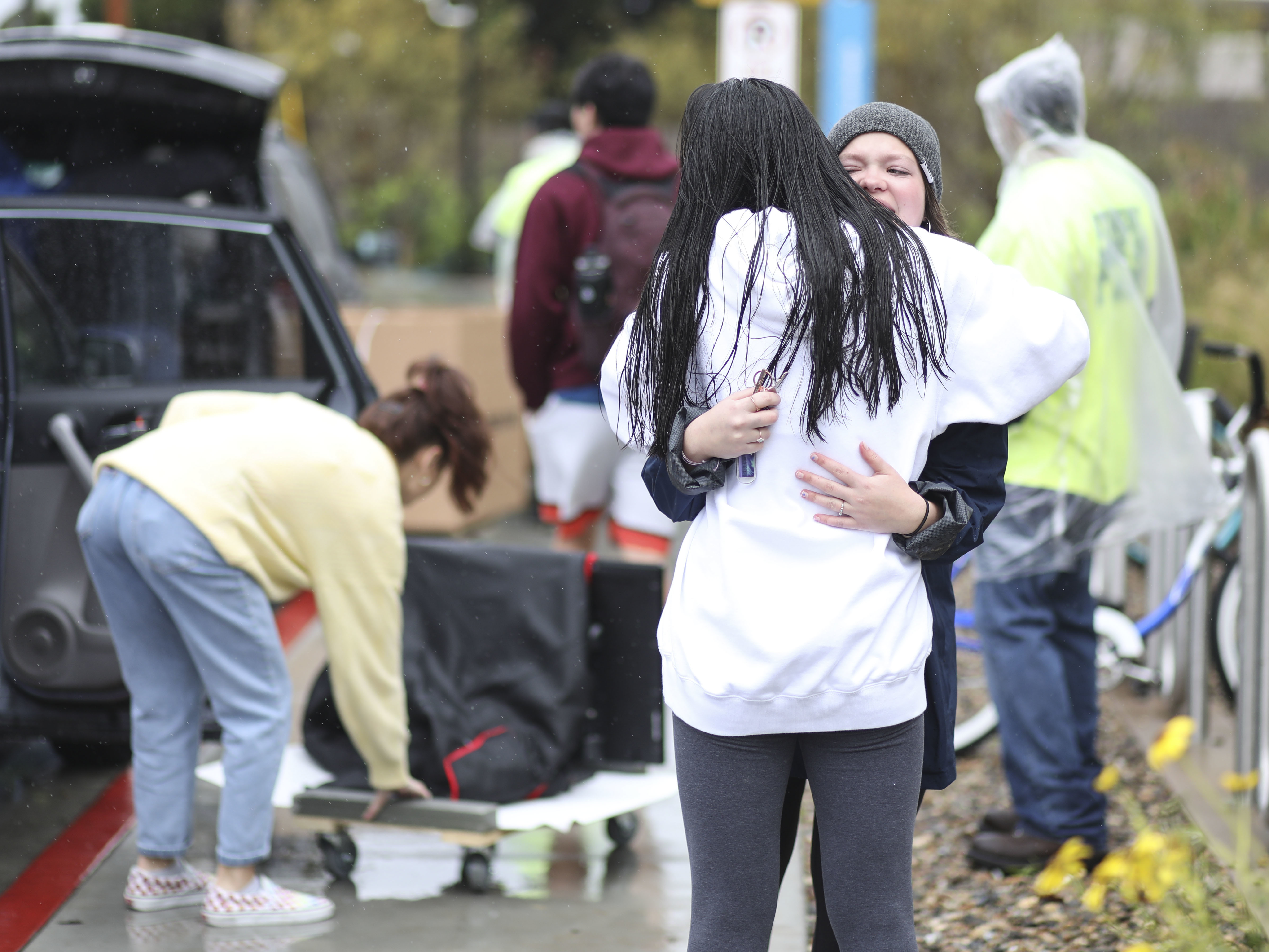 caption: Students move out of dormitories at San Diego State University in March, after the university cancelled the rest of the semester and has asked students to move out within 48 hours. Nine percent of young adults say they've moved due to the COVID-19 pandemic.