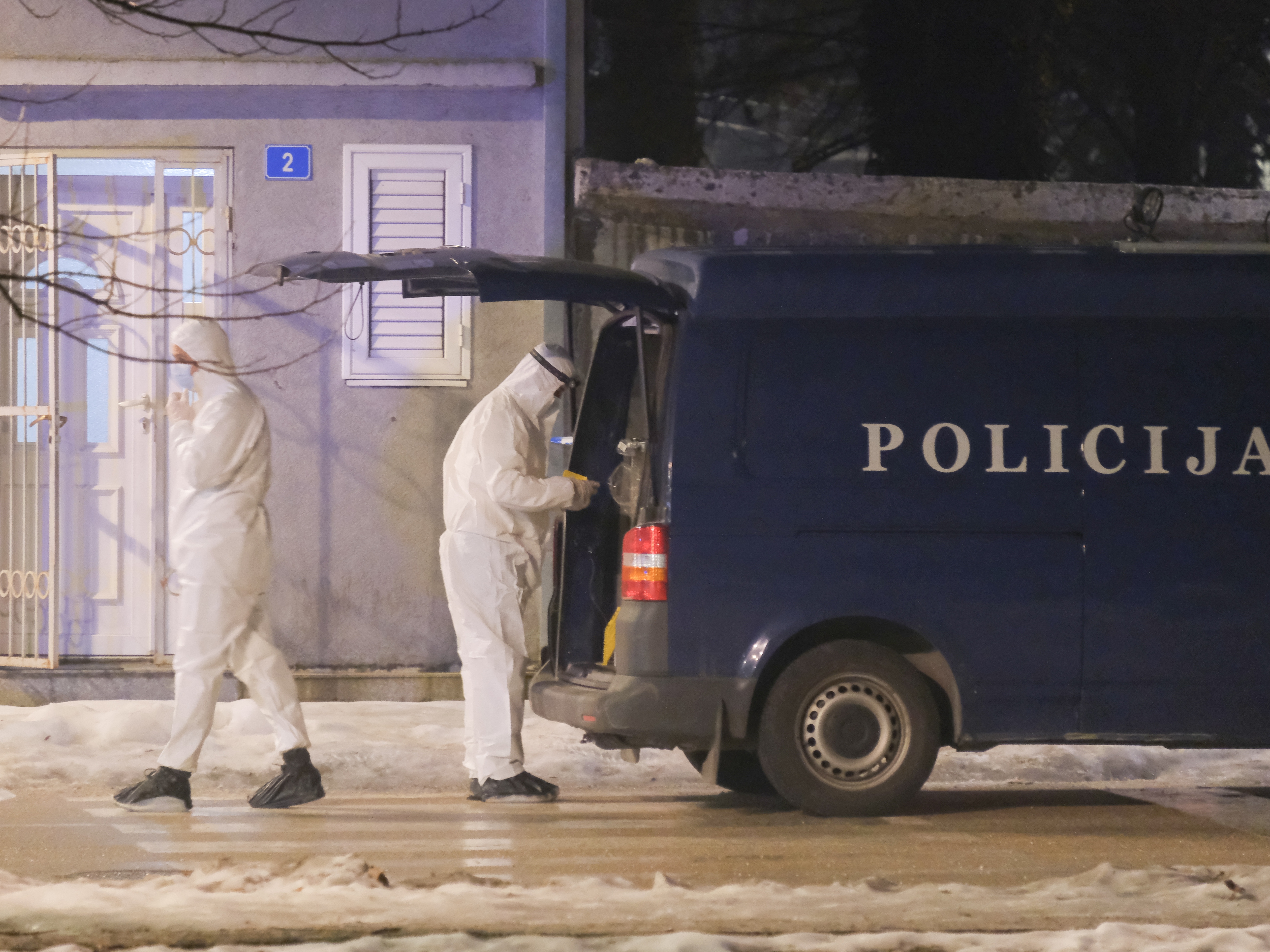 caption: Police investigators work at the site of a shooting in Cetinje, located 22 miles west of Podogrica, Montenegro, Wednesday, Jan 1, 2025.