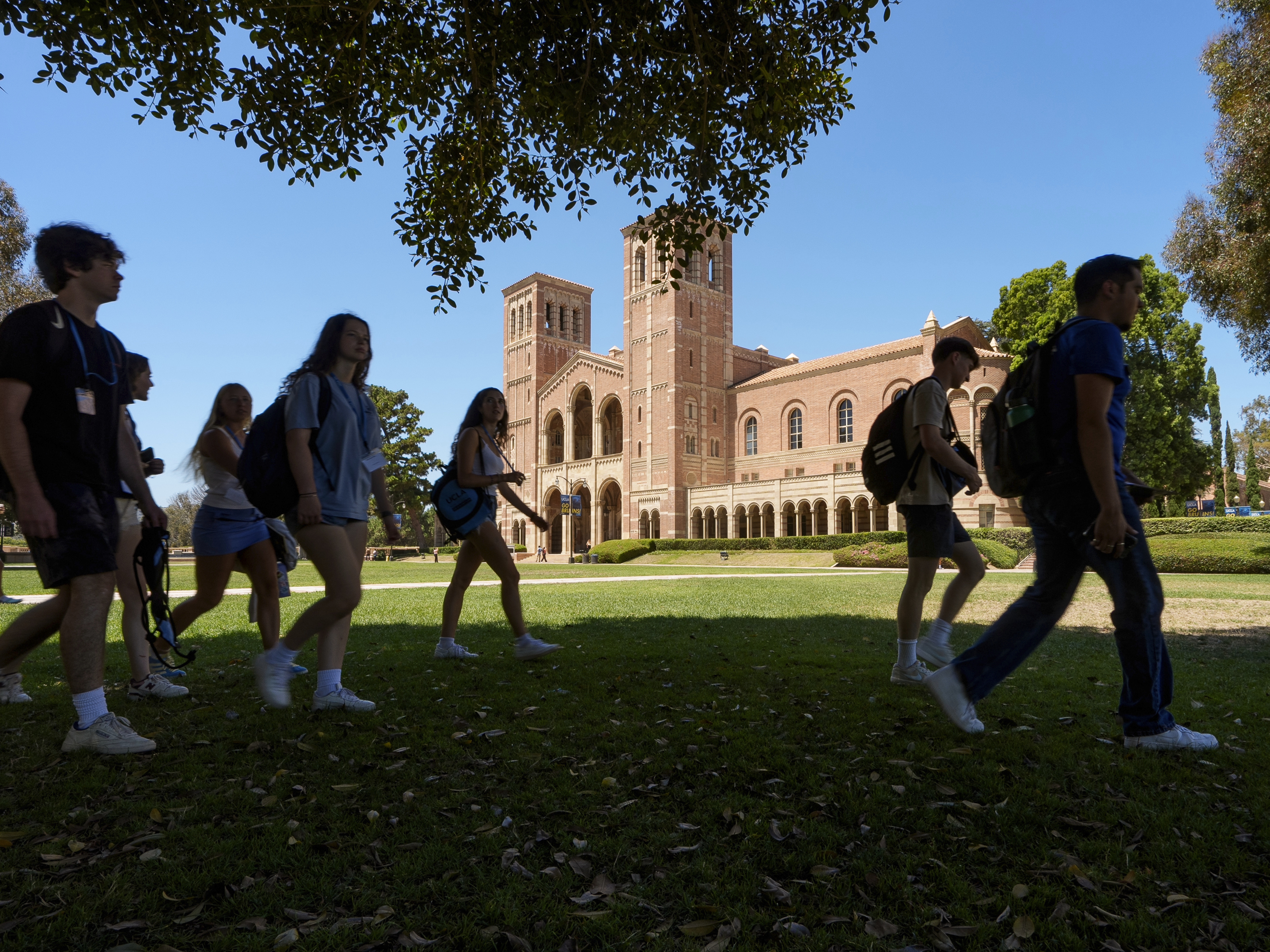 caption: Students walk past Royce Hall at the UCLA campus in Los Angeles on Aug. 15, 2024.