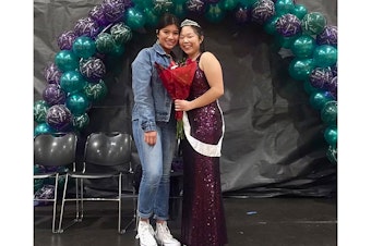 caption: Ella Chung, right, and a friend at homecoming in 2018. 