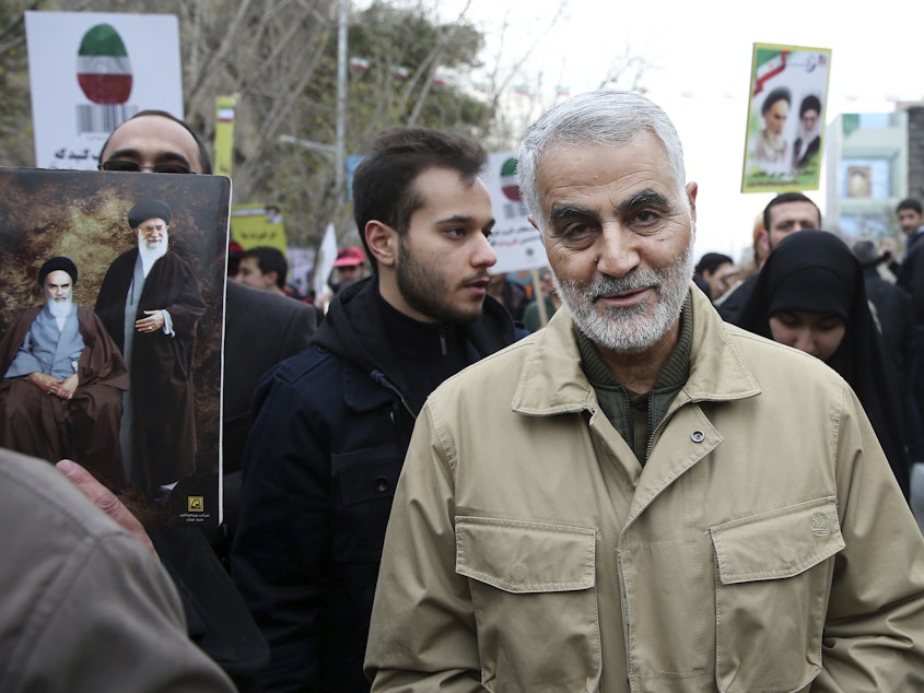 caption: Qassem Soleimani, pictured at a 2016 rally commemorating the anniversary of the Islamic Revolution, commanded Iran's Quds Force and had wide influence in Iran's foreign policy.