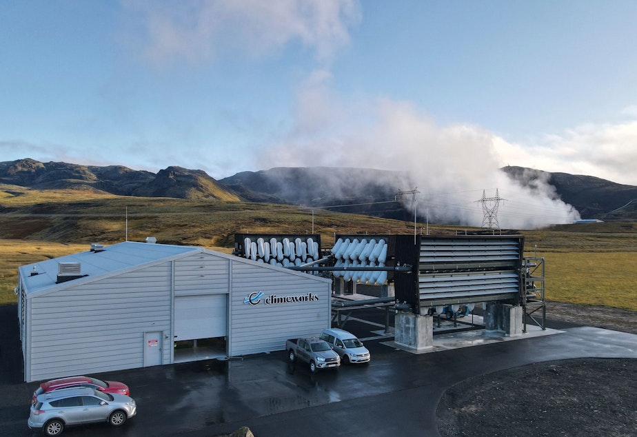 caption: Climeworks factory with it's fans in front of the collector, drawing in ambient air and release it, as largely purified CO2 through ventilators at the back is seen at the Hellisheidi power plant near Reykjavik on October 11, 2021.