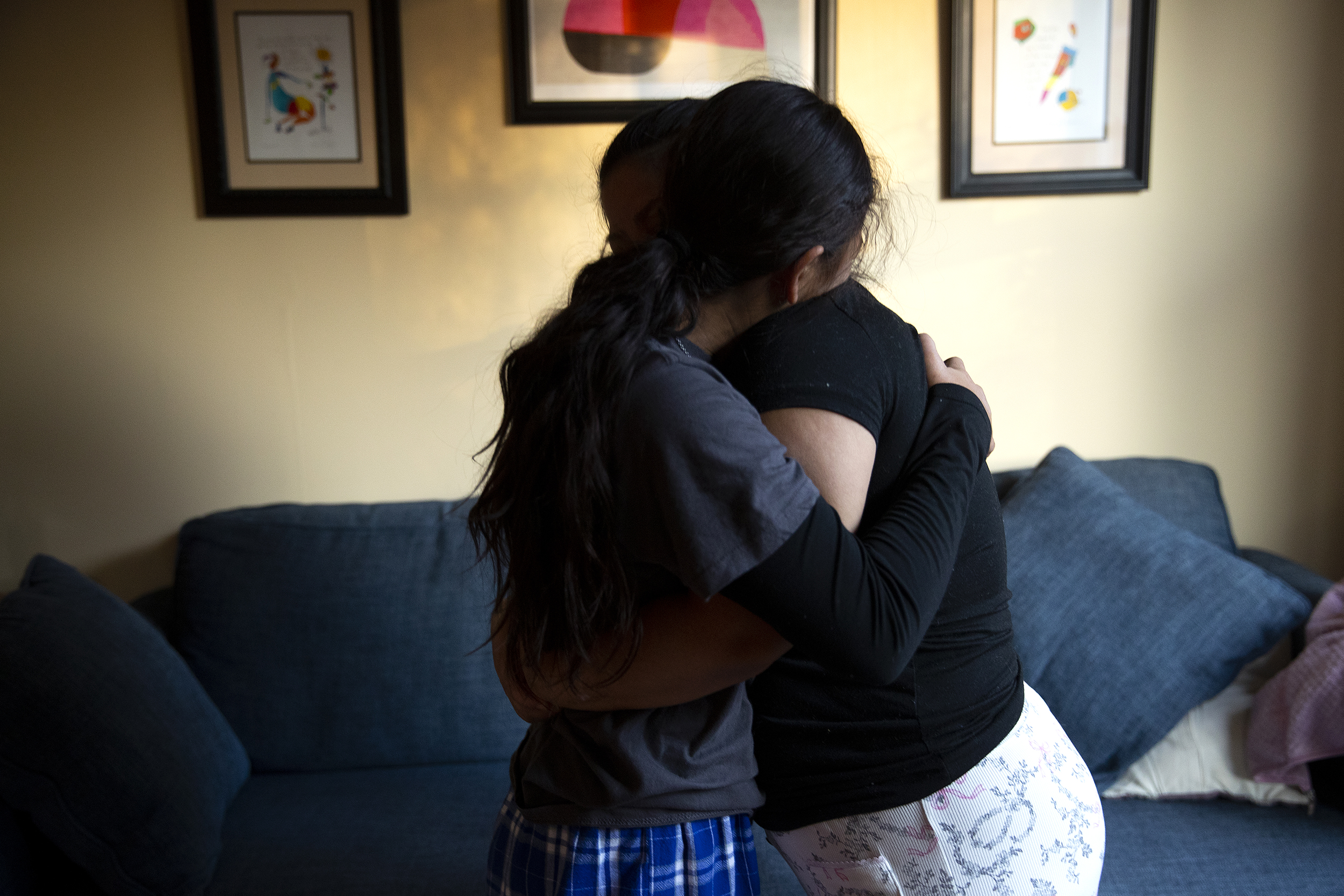 caption: Alejandra hugs her daughter, age, 11, at Karina’s home on Friday, January 23, 2026, in Seattle. 