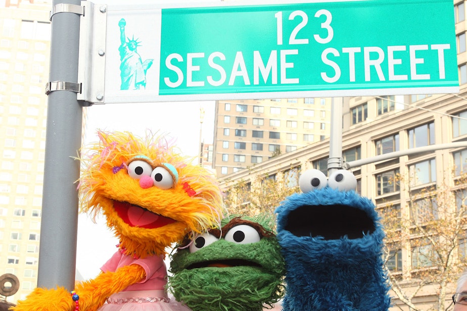 caption: Sesame Street characters pose under a "123 Sesame Street" sign at the "Sesame Street" 40th Anniversary temporary street renaming in Dante Park on Nov. 9, 2009 in New York City. (Astrid Stawiarz/Getty Images)
