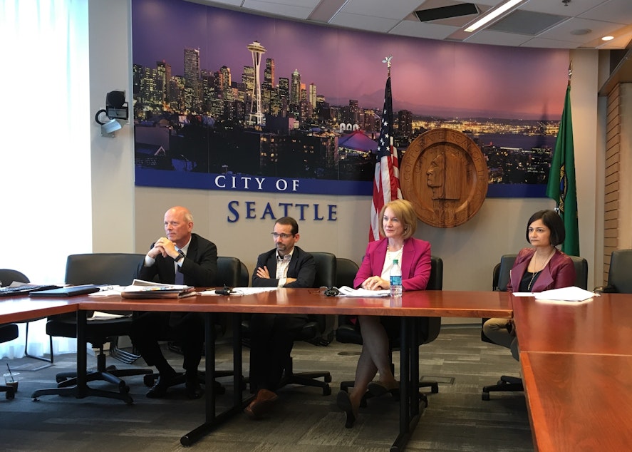 caption: Seattle Mayor Jenny Durkan briefs reporters on the report from KPMP, August 31, 2018. With her are Deputy Mayor Shefali Ranganathan, Budget Director Ben Noble and departing SDOT Goran Sparrman.  