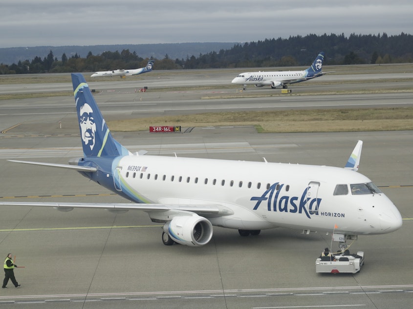 caption: An Alaska Airlines plane, like this one operated by Horizon Air, had to divert to Portland, Ore. on Sunday after an off-duty pilot tried to turn off the engines in flight.