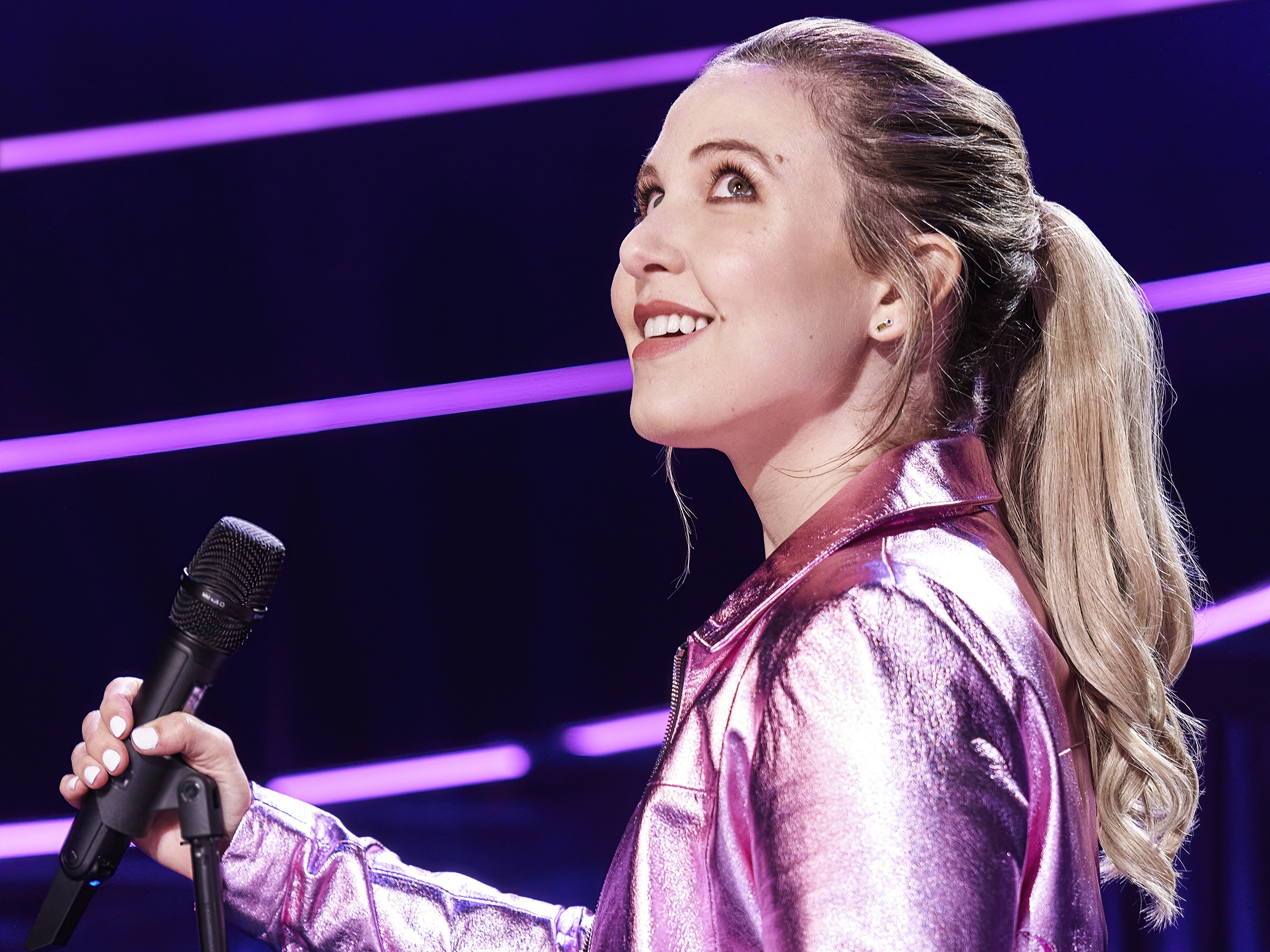 caption: Taylor Tomlinson says her on stage presence isn't a persona or a character: "It's just the best version of me."