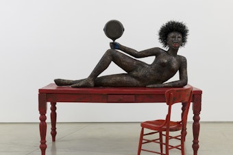caption: "She's challenging you to sit down in that chair," Los Angeles artist Alison Saar says of her 2019 sculpture,<em> Set to Simmer.</em>