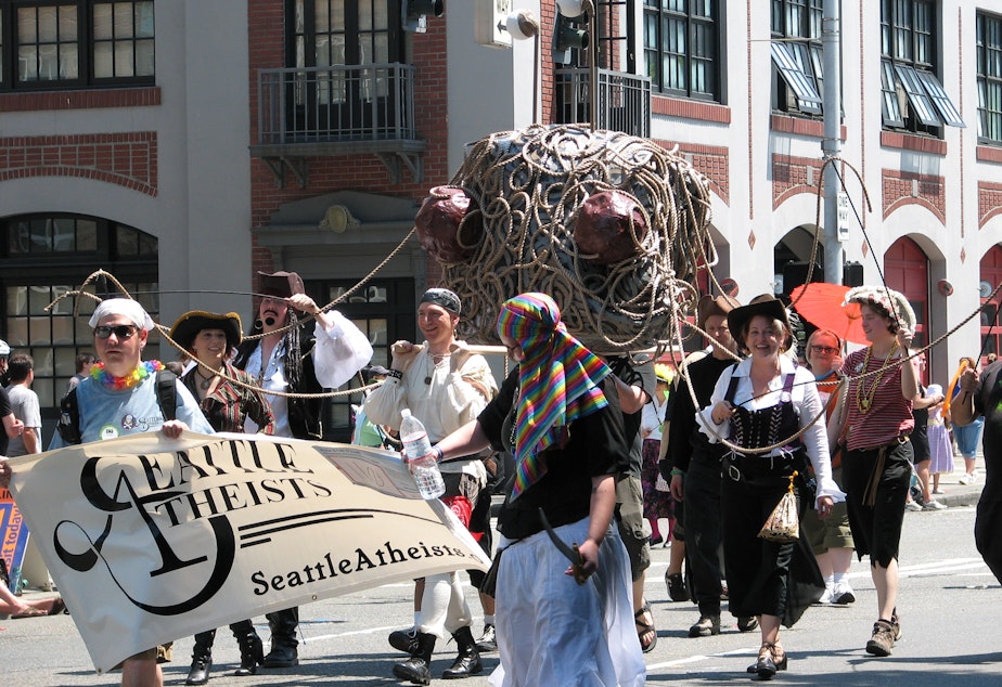 caption: Seattle atheists march in a parade. Ten percent of the city identifies as atheist, actively not believing in God. That's the highest percentage among large cities in the U.S., according to a Pew Research survey.