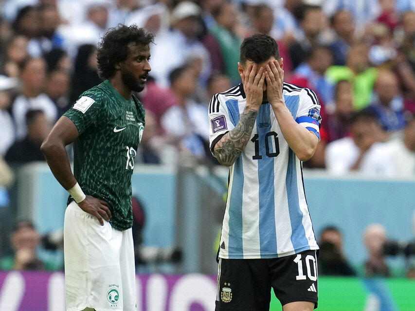 caption: Argentina's Lionel Messi reacts in disappointment Tuesday during the World Cup group C soccer match between Argentina and Saudi Arabia at the Lusail Stadium in Lusail, Qatar.