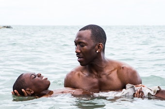 caption: Juan (played by Mahershala Ali) teaches Chiron (Jaden Piner) how to swim in <em>Moonlight</em>. The film is told with different actors playing Chiron at different stages of his life.