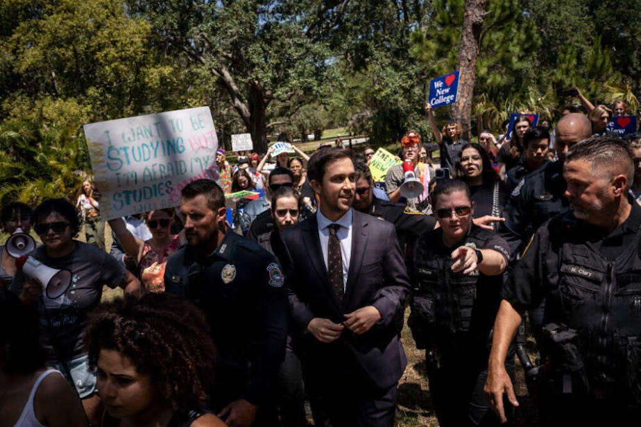 caption: Christopher Rufo, a conservative activist. (Thomas Simonetti for The Washington Post via Getty Images)