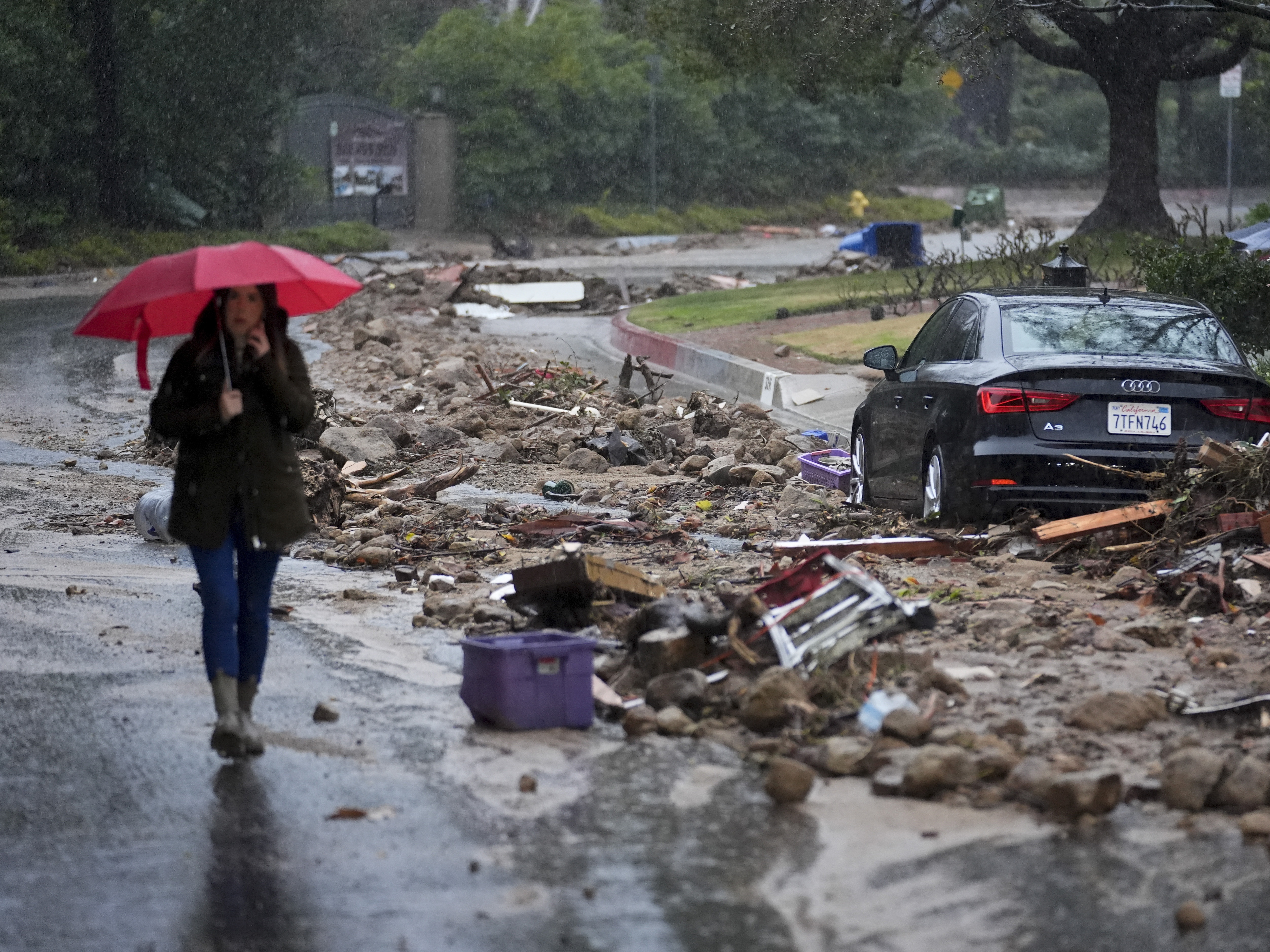 caption: Mud and debris as atmospheric rivers dumped rain in Studio City, Calif., in 2024. Forecasting heavy rain requires measurements from satellites, doppler radar, ocean buoys and other instruments, most of which are operated by the federal government.