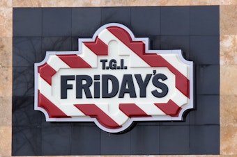 caption: An image of the sign for T.G.I Friday's as photographed on March 16, 2020 in Levittown, New York.