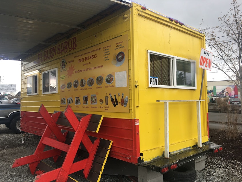 caption: El Buen Sabor taco truck in South Park. No public seating allowed for now.