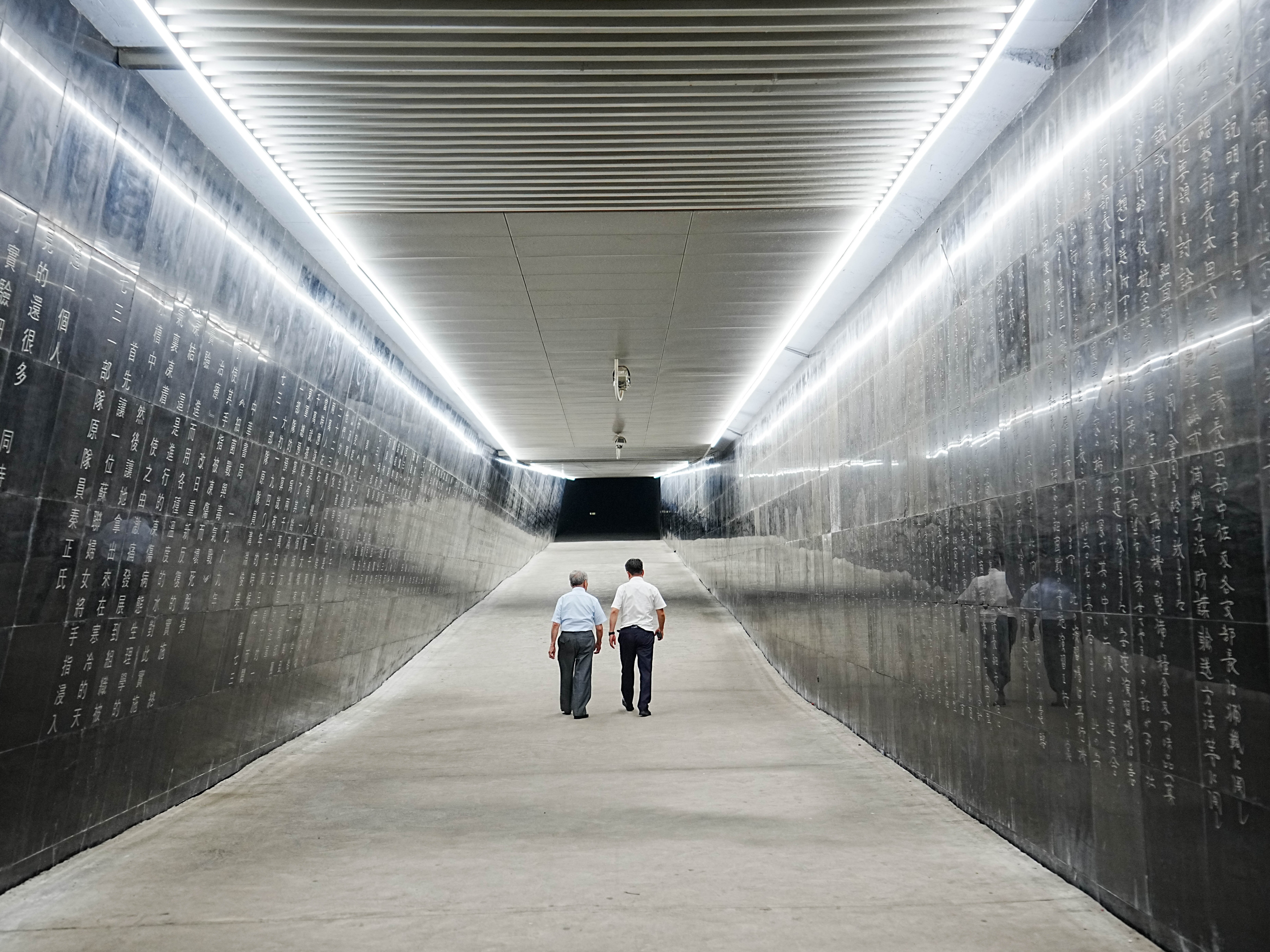 caption: Hideo Shimizu L visits the Exhibition Hall of Evidences of Crime Committed by Unit 731 of the Japanese Imperial Army in Harbin, northeast China's Heilongjiang Province, Aug. 13, 2024. After a 79-year hiatus, Hideo Shimizu, a former member of Unit 731, the notorious Japanese germ-warfare detachment during World War II, returned to China to acknowledge the atrocities committed by the invading Japanese forces and to offer sincere repentance and apologies to the victims.