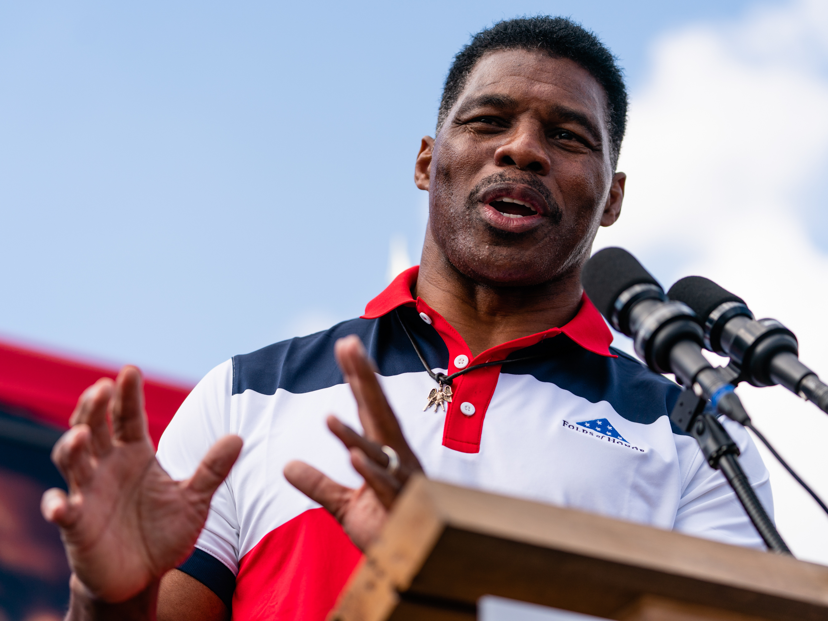 caption: Georgia Republican Senate candidate Herschel Walker speaks at a campaign event in Carrollton in October.