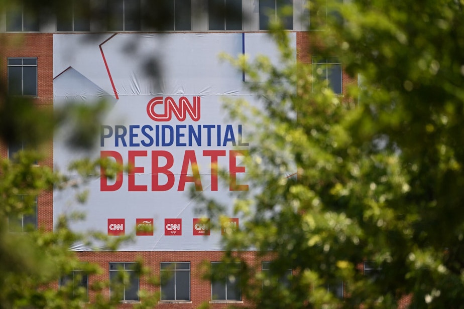 caption: CNN signage hangs outside the studios at the Turner Entertainment Networks as Atlanta prepares one day ahead of the first 2024 presidential debate between US President Joe Biden and former President Donald Trump, on June 26, 2024. ANDREW CABALLERO-REYNOLDS/ AFP via Getty Images