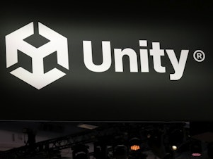 caption: A Unity sign is displayed at the company's booth at the Game Developers Conference 2023 in San Francisco.