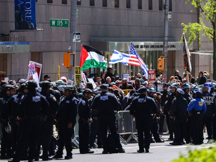 caption: Pro-Palestinian and pro-Israel protesters face off outside of Columbia University on April 22, 2024.