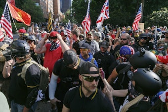 caption: Proud Boy and Patriot Prayer members staged a “Freedom and Courage” rally and march in Portland, Ore., on June 30, 2018. CREDIT: John Rudoff/Sipa USA