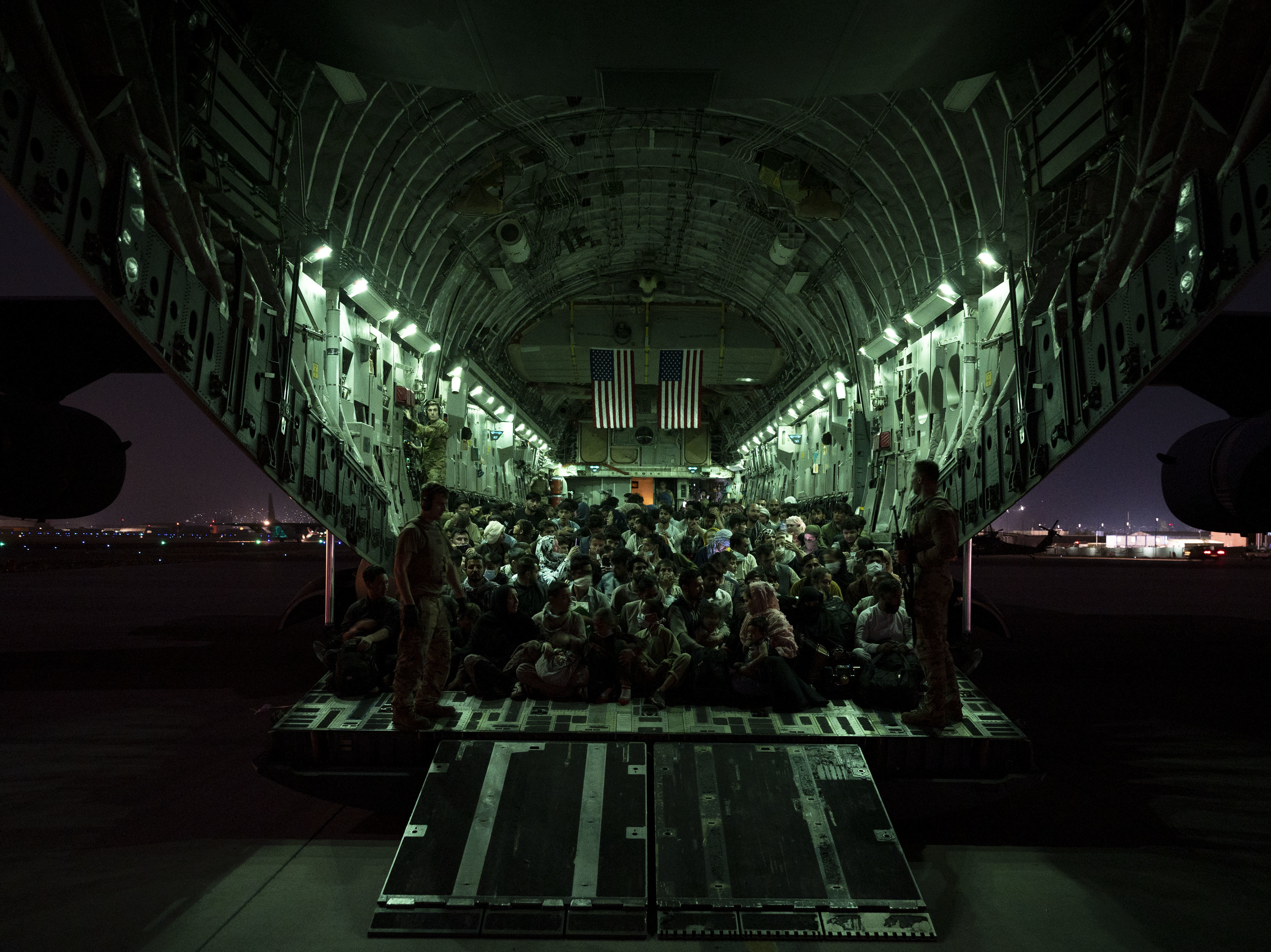 caption: The U.S. withdrawal from Afghanistan, which saw scenes of desperation and violence inside and outside of Kabul's airport, has coincided with a drop in President Biden's approval rating. Biden has fiercely defended the evacuation.