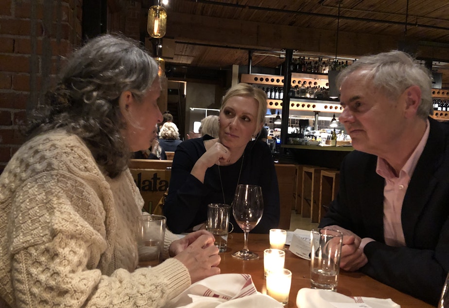 caption: Cheryl Jennings, left, her neighbor Ali Taylor, and Wes Van Voorhis at a recent Death Over Dinner event on Capitol Hill. 