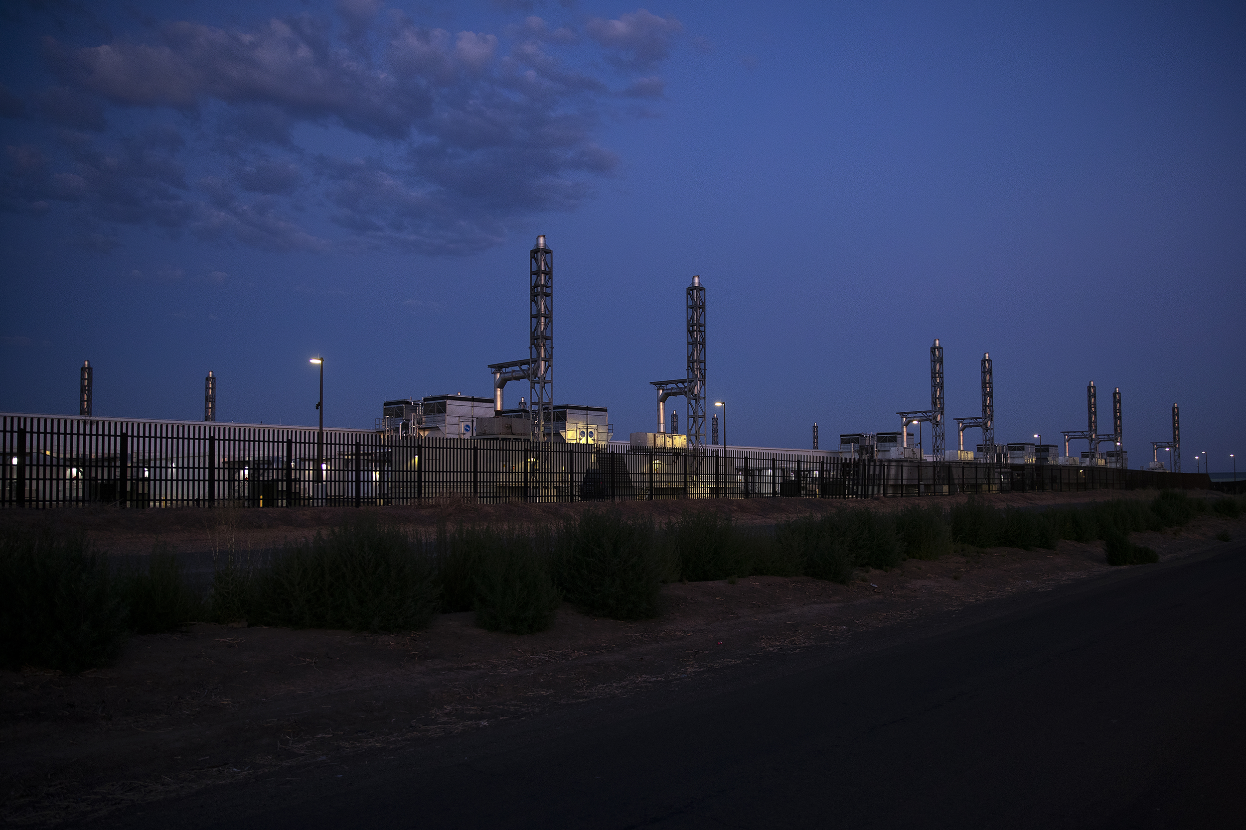caption: A Microsoft data center is shown as the sun goes down on Thursday, July 17, 2025, in Quincy, Washington. 