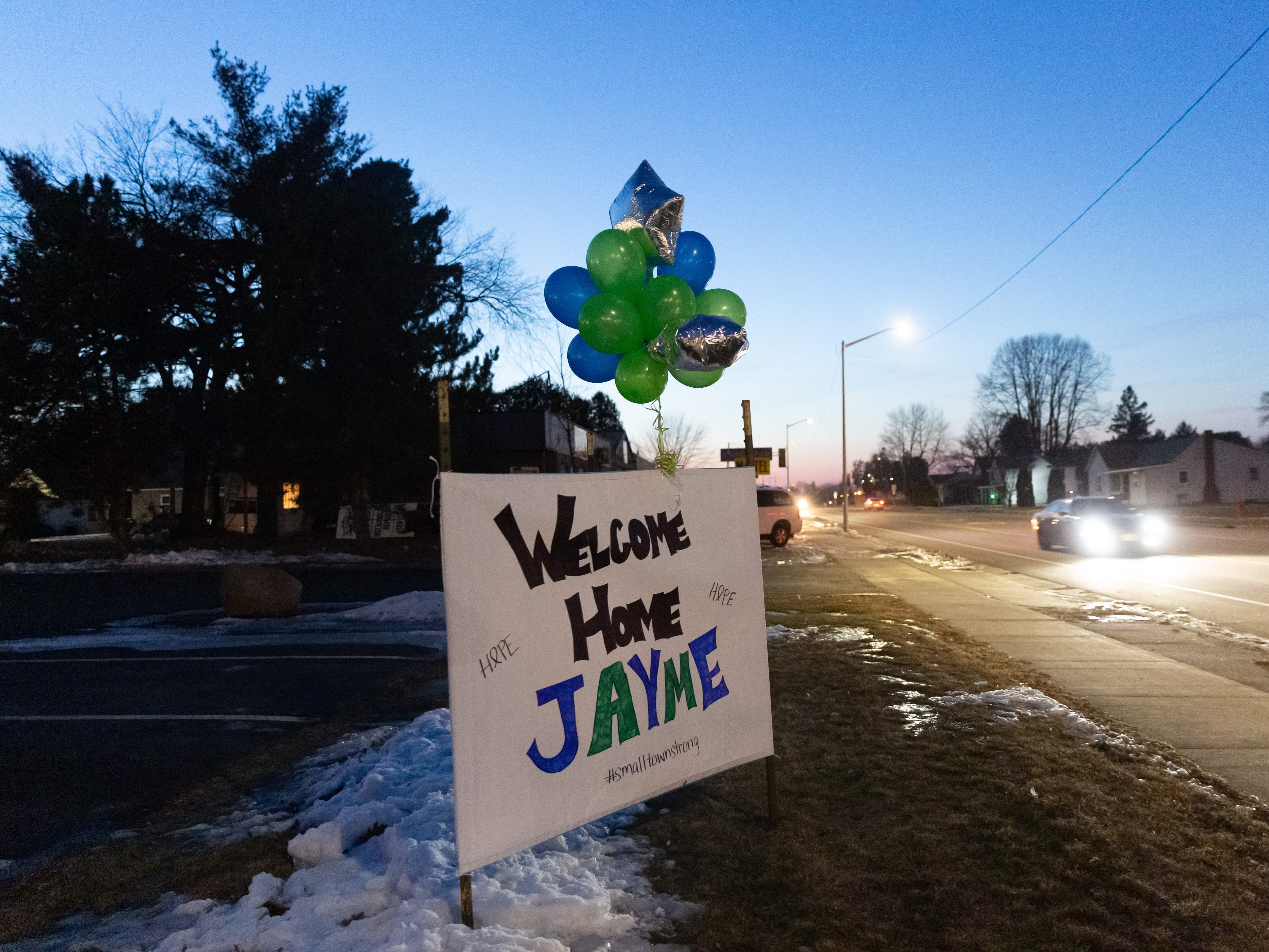 caption: A "Welcome Home" sign on Jan. 11 in northern Wisconsin, one day after missing 13-year-old Jayme Closs came out of the woods.