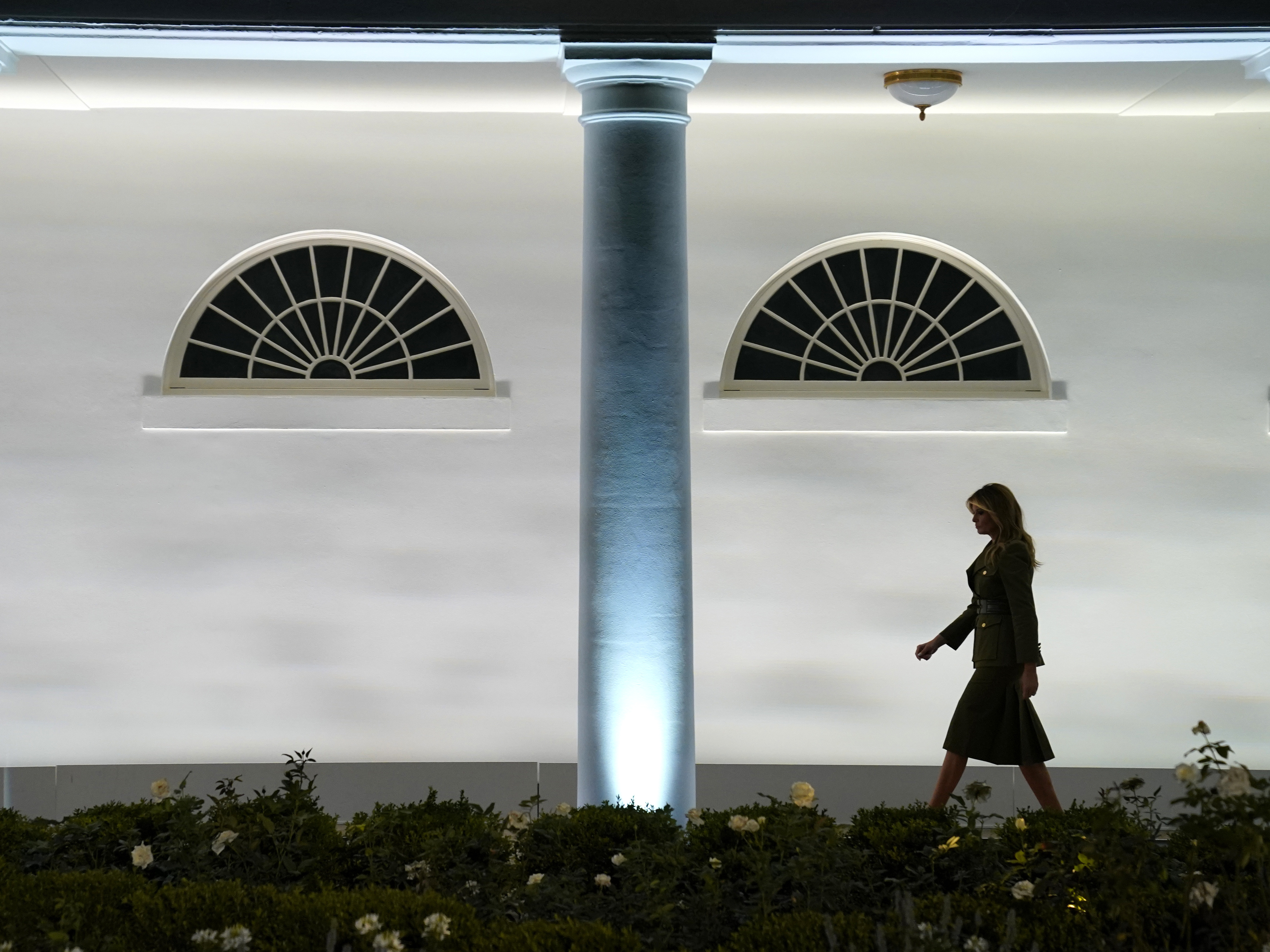 caption: First lady Melania Trump arrives to speak to the Republican National Convention from the White House on Tuesday. She empathized with those struggling with the coronavirus in her remarks.