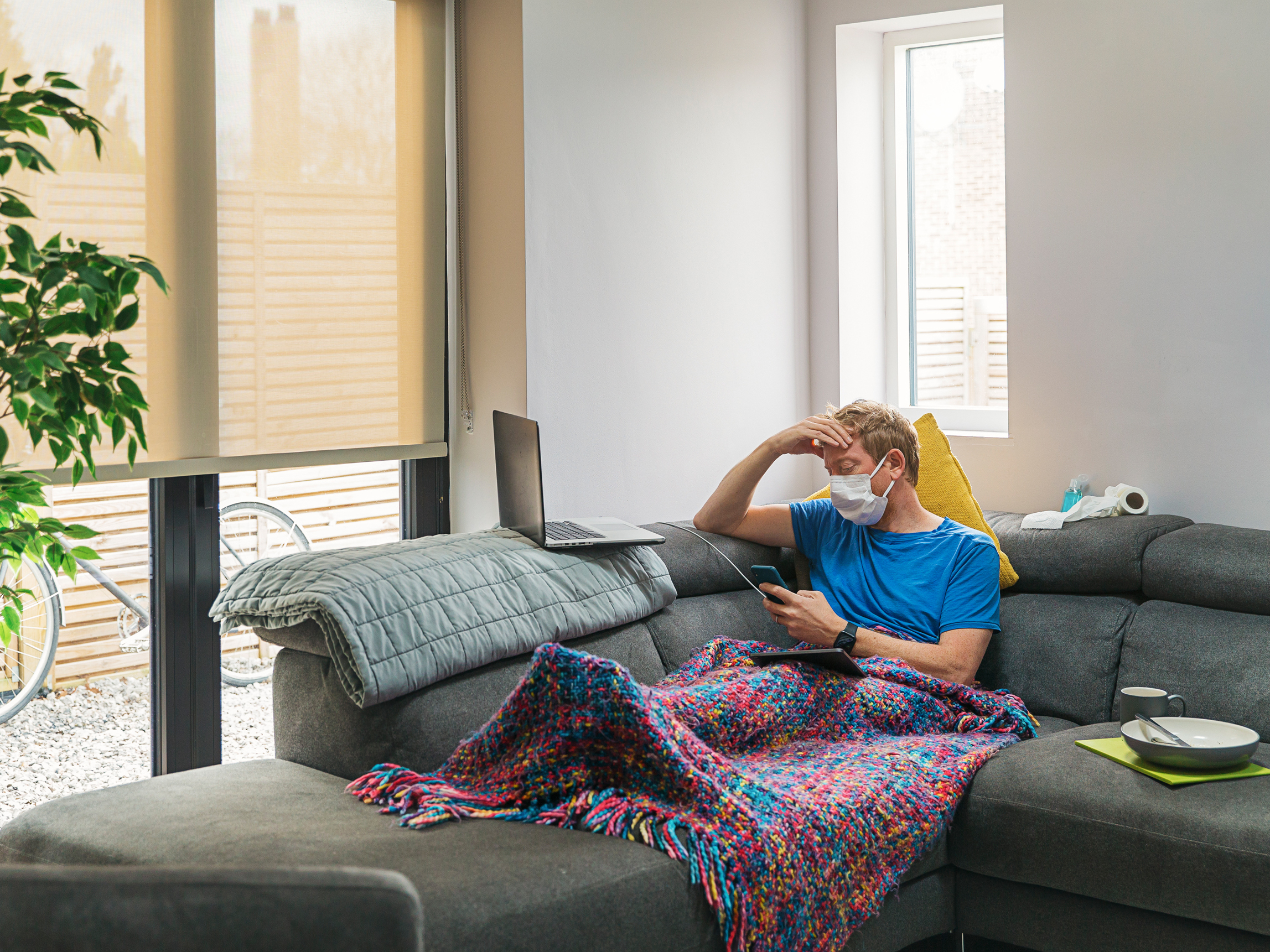 caption: Coronavirus symptoms vary person to person, as does the length of the infection. If you're sick, use caution when deciding to leave isolation.