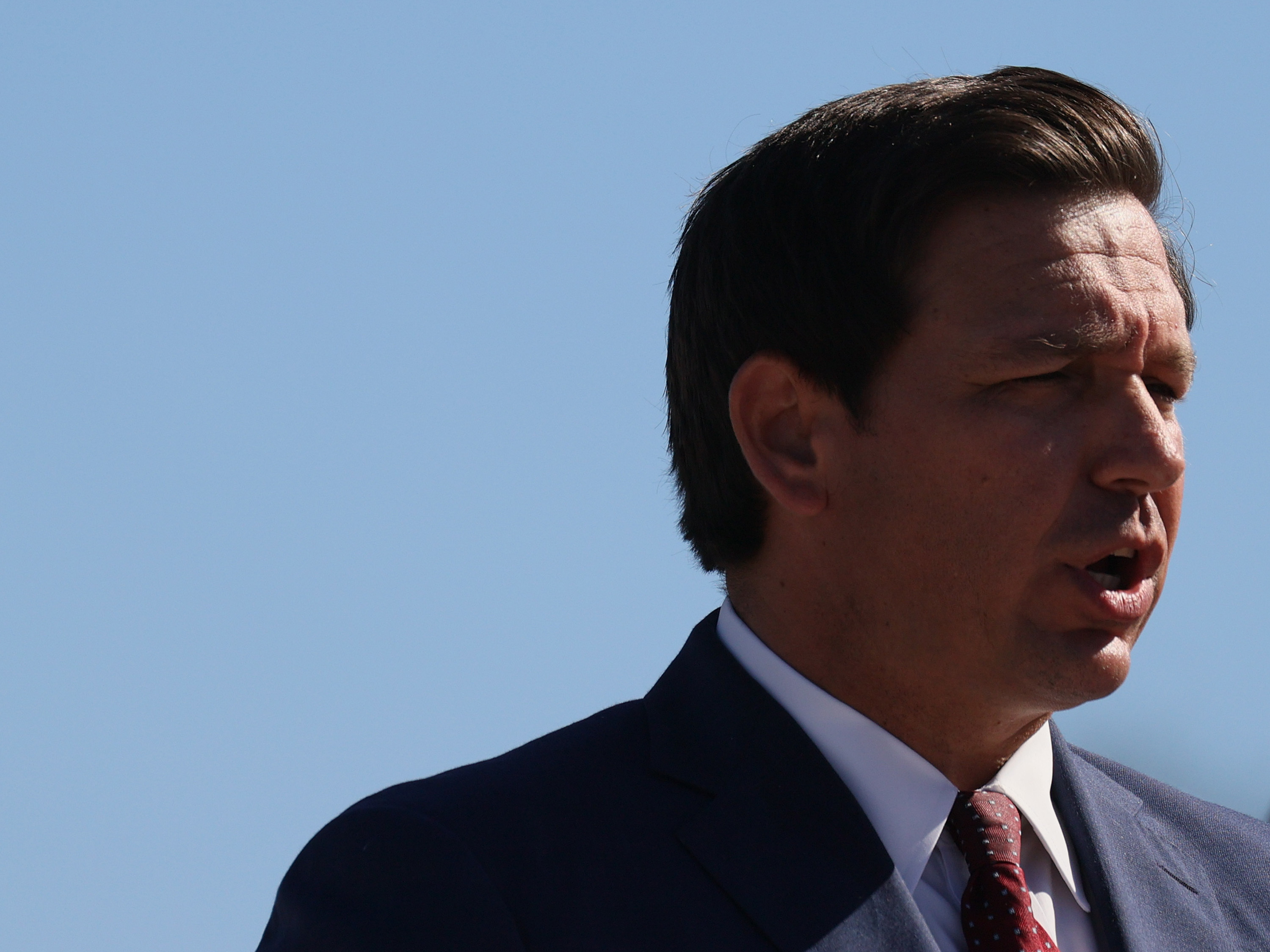 caption: Florida Gov. Ron DeSantis, seen here in January, said on Monday that he will issue emergency rules to prevent businesses from requiring proof of vaccination.