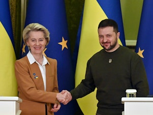 caption: Ukrainian President Volodymyr Zelenskyy and European Commission President Ursula von der Leyen shake hands after a joint press conference after talks in Kyiv on Thursday.