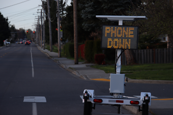 caption: A pilot program for "SmartSigns" is underway in King County. The signs use infrared technology to detect if a driver is distracted, speeding, not using a seatbelt, or other driving issues. The sign will then show a personalized message for that driver, telling them to slow down or put their phone down. 
