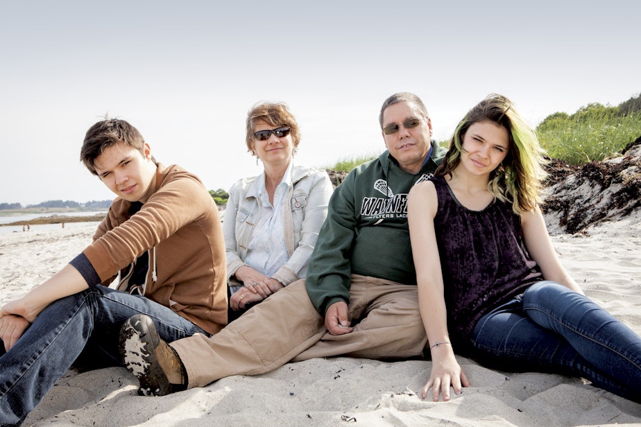 caption: Nicole Maines along with her twin brother Jonas and parents Kelly and Wayne.