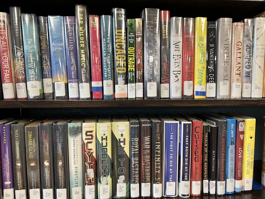 caption:  Young adult books at the Columbia County Library. Some people have requested to move the YA section into the adult section because of what they call "obscene" material in 100 of the around 800 books.