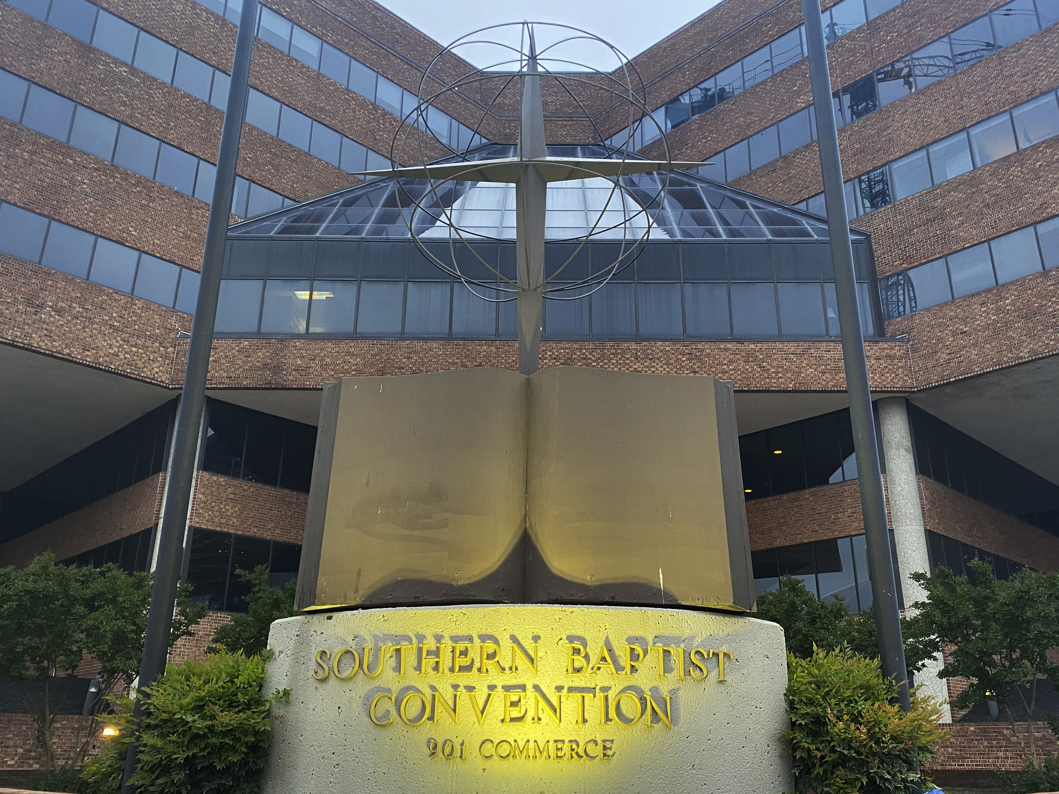 caption: A cross and Bible sculpture stand outside the Southern Baptist Convention headquarters in Nashville, Tenn., on Tuesday. Southern Baptist leaders have released a list of hundreds of pastors and other church-affiliated personnel accused of sexual abuse.
