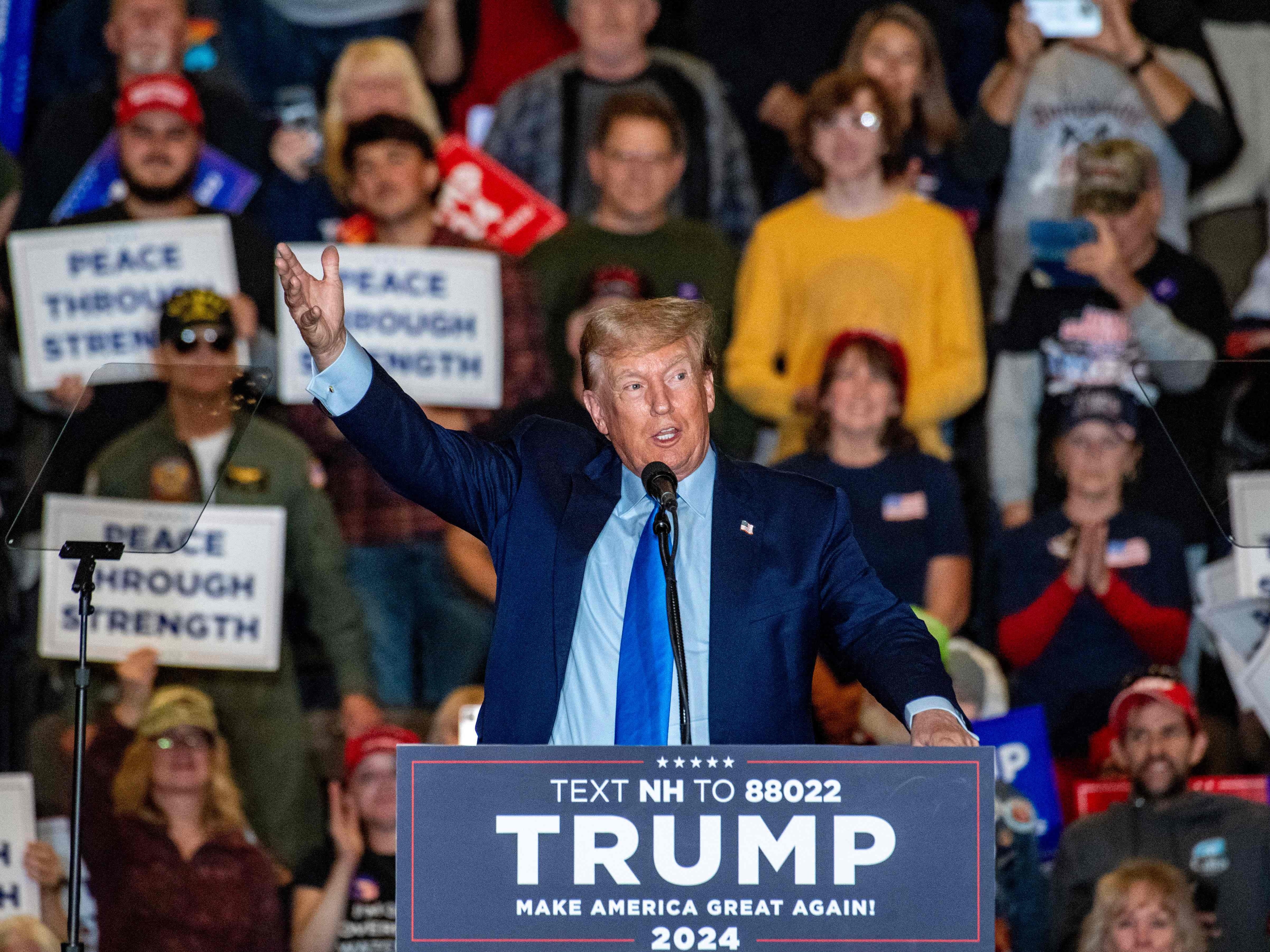 caption: Former President and 2024 Republican president candidate Donald Trump speaks at a campaign rally in Claremont, N.H., on Saturday.