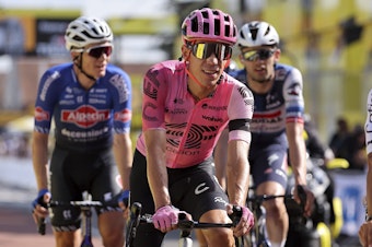 caption: Rigoberto Urán crosses the finish line of stage 12 of the 110th Tour de France, July 13, 2023, in Belleville-en-Beaujolais, France.