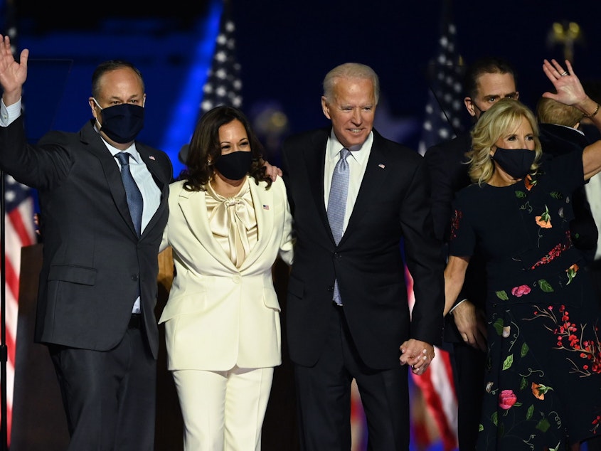 caption: Incoming President Biden and Vice President Harris stand with their respective spouses Jill Biden and Doug Emhoff after delivering remarks in Wilmington, Del., on Nov. 7, the day the Democrats were declared the winners in the 2020 election.