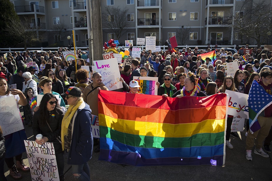 caption: Hundreds gather before a student walkout to protest the departure of two LGBT educators on Tuesday, February 18, 2020, at Kennedy Catholic High School in Burien.
