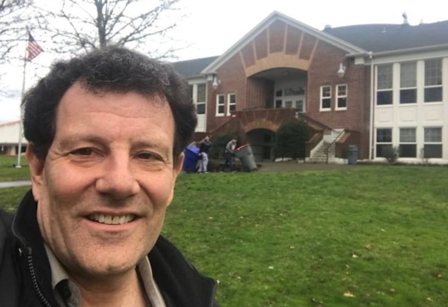 caption: Nicholas Kristof selfie: 'That's me in front of my old high school in Yamhill, Oregon.'