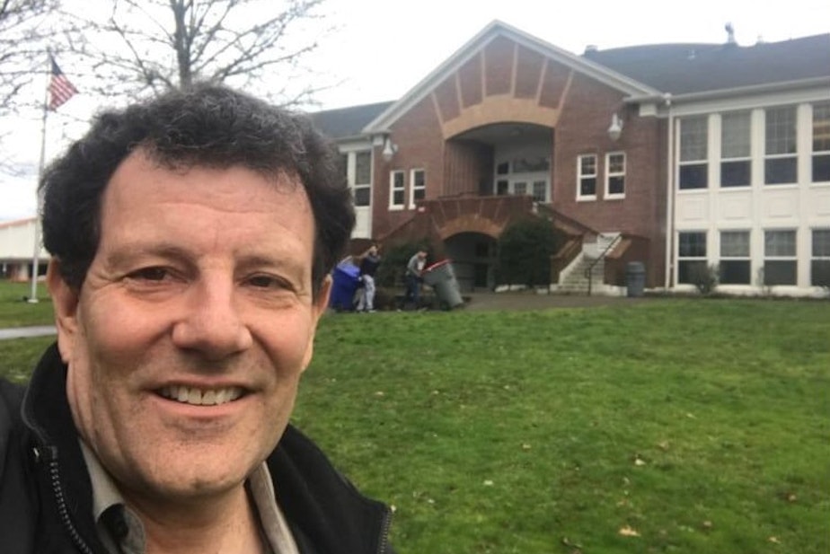 caption: Nicholas Kristof selfie: 'That's me in front of my old high school in Yamhill, Oregon.'