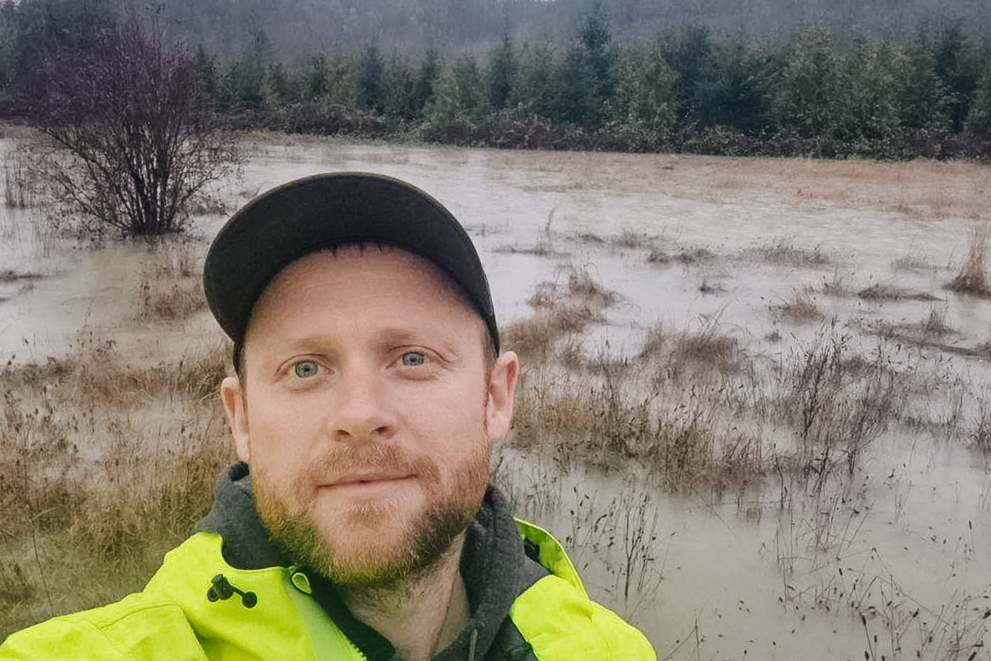 caption: Tyler Stiltner, senior operator of the King County wastewater treatment plant in Carnation, takes a selfie during flooding.