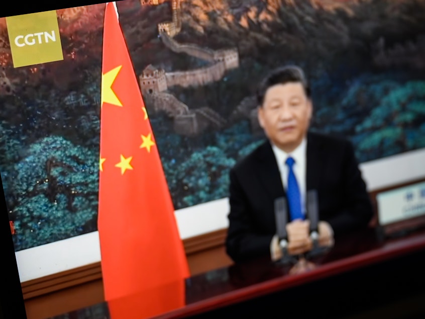 caption: President Xi Jinping of China is seen on a CGTN archive program as it plays on a computer monitor in London. The U.K.'s Ofcom says Star China Media Limited, which holds the license for China Global Television Network (CGTN) doesn't have day-to-day editorial control over the channel, which is against its rules.