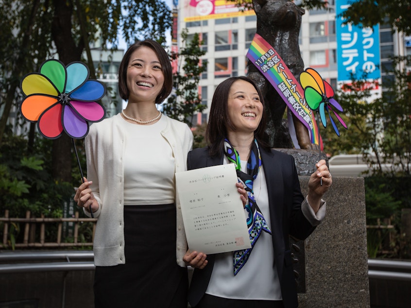 caption: In this 2015 photo, Koyuki Higashi (L) and Hiroko Masuhara (R) celebrate and hold up their same-sex marriage certificate in Tokyo. Shibuya Ward in Tokyo became the first local government in Japan to recognize same-sex partnerships. Today 13 gay couples filed a lawsuit arguing the country's general rejection of gay marriage rights violates the constitution.